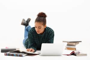 portrait of young african girl with laptop over white background - fk partners